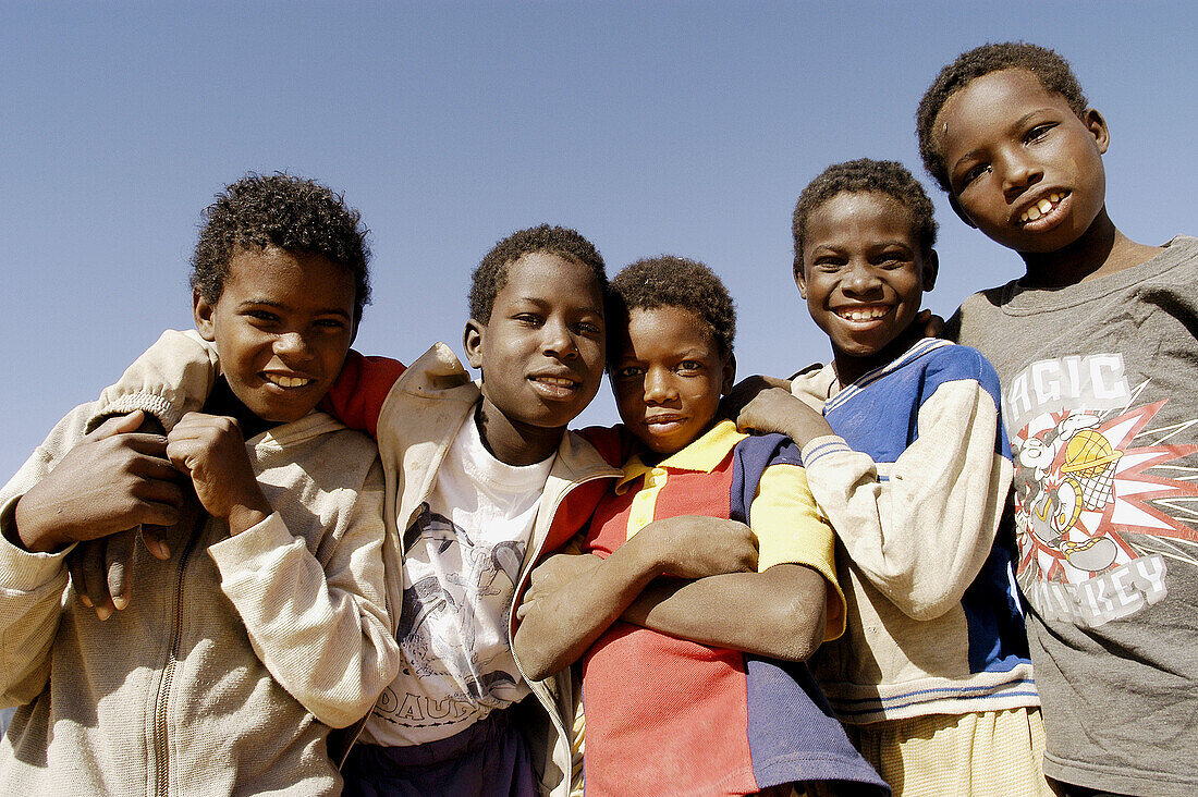 Group of boys in a small oasis between Ouadane and Chinguetti. Mauritania.