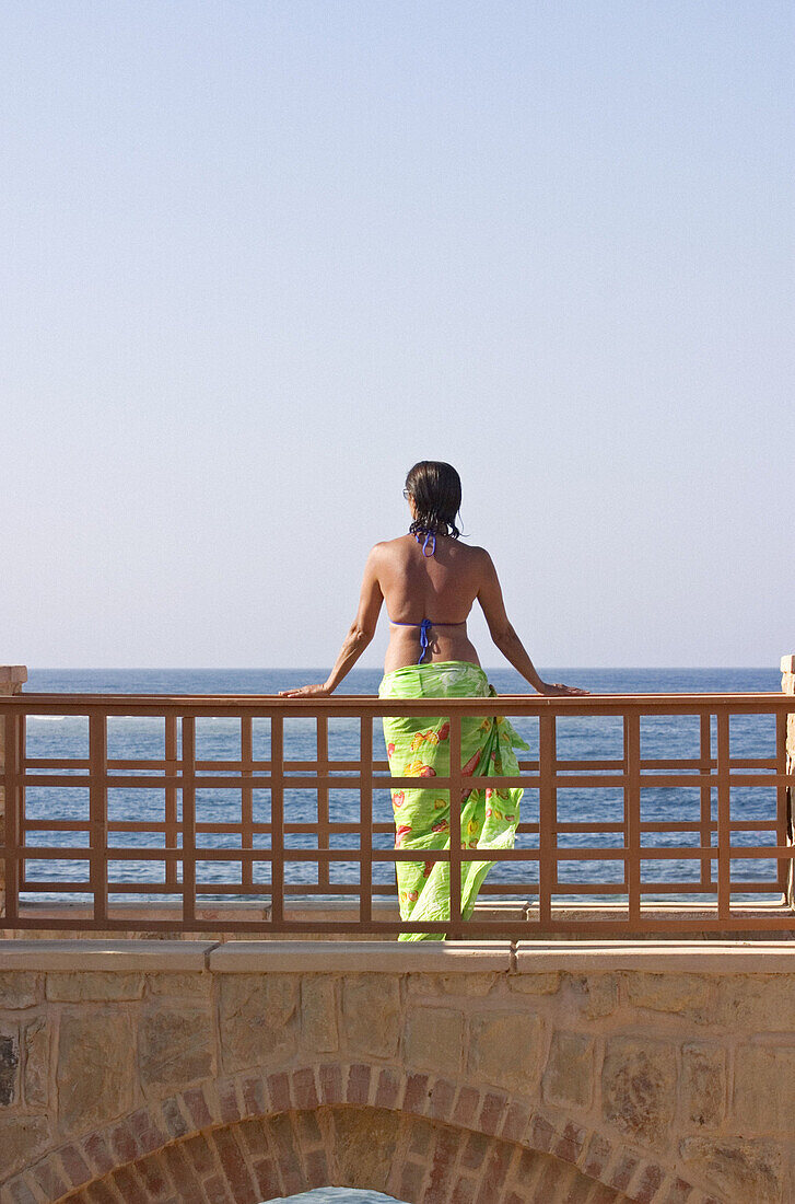 Woman Standing on Bridge in Holiday Resort in Swimming Costume, Red Sea, Egypt