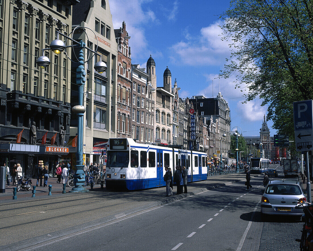 Trams on the Damrak. Amsterdam. Holland