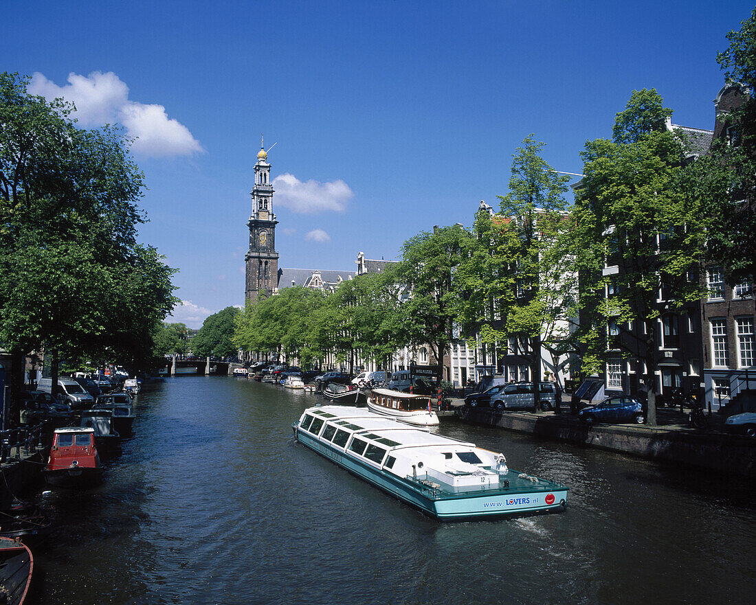 Pleasure boats on an Amsterdam canal. Amsterdam. Holland