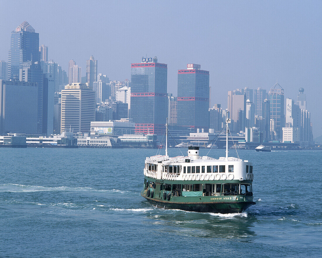 Star ferries crossing Victoria harbour. Hong Kong.