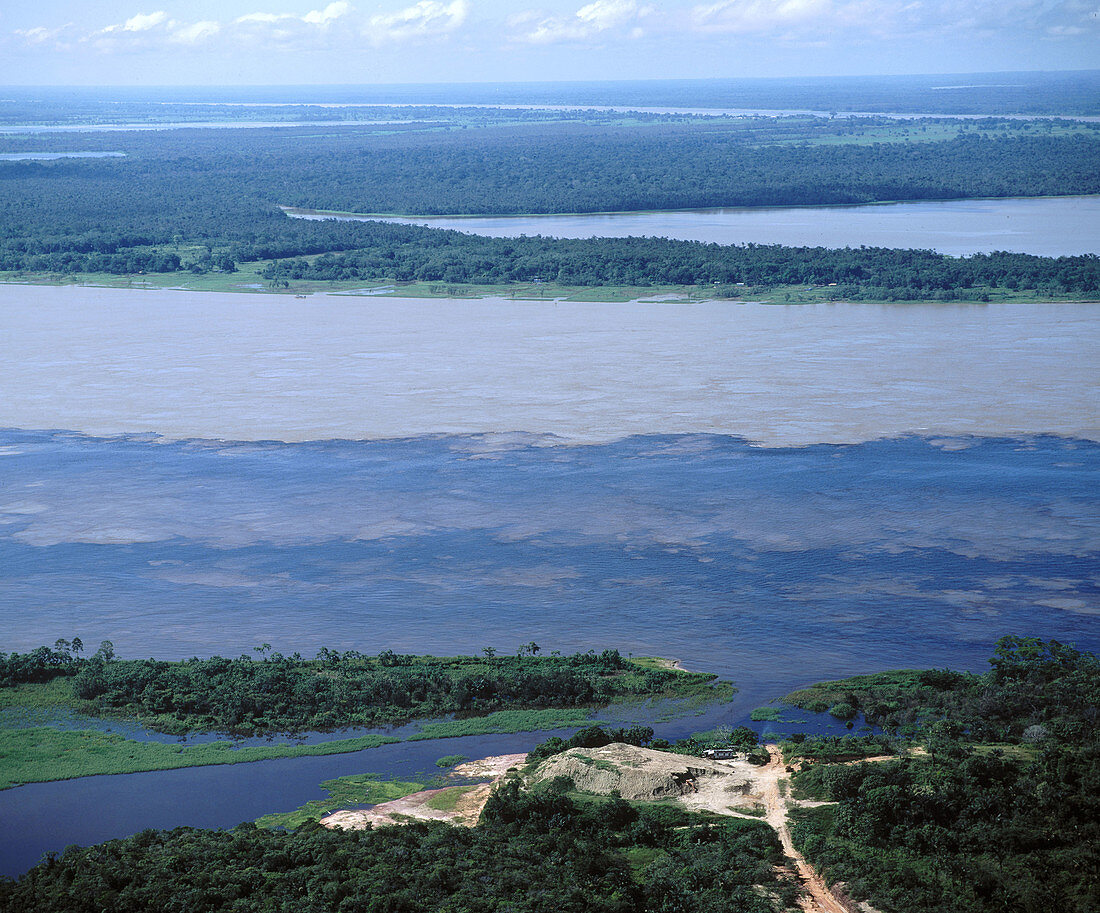 Where Rio Negro meets Solimões. Amazon River. Brazil.