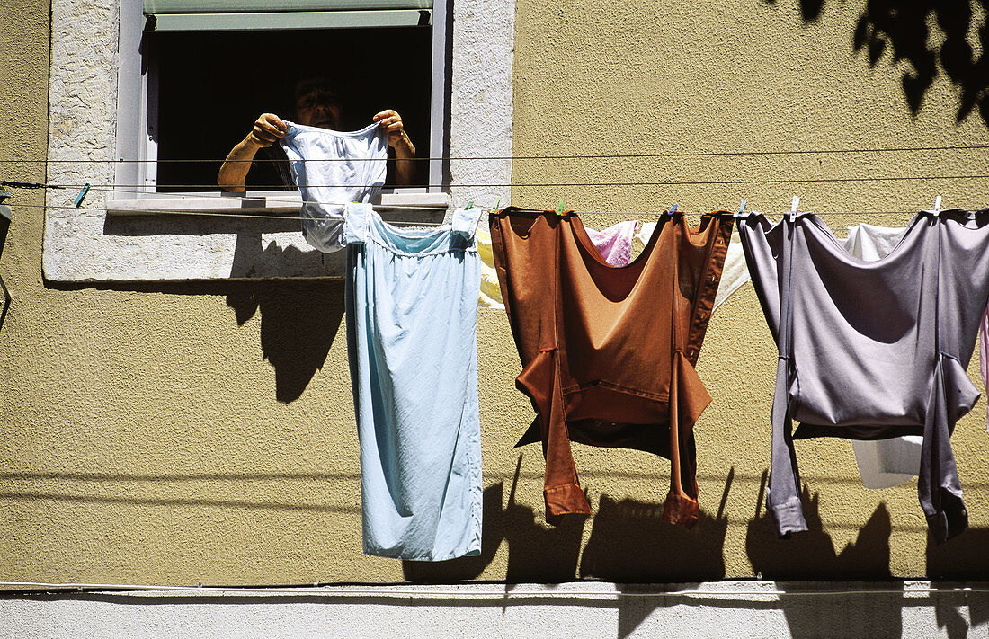 Clothes drying at window. Lisbon. Portugal