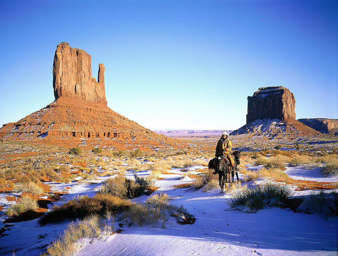 Navajo rider in winter. Monument valley. Arizona-Utah. USA