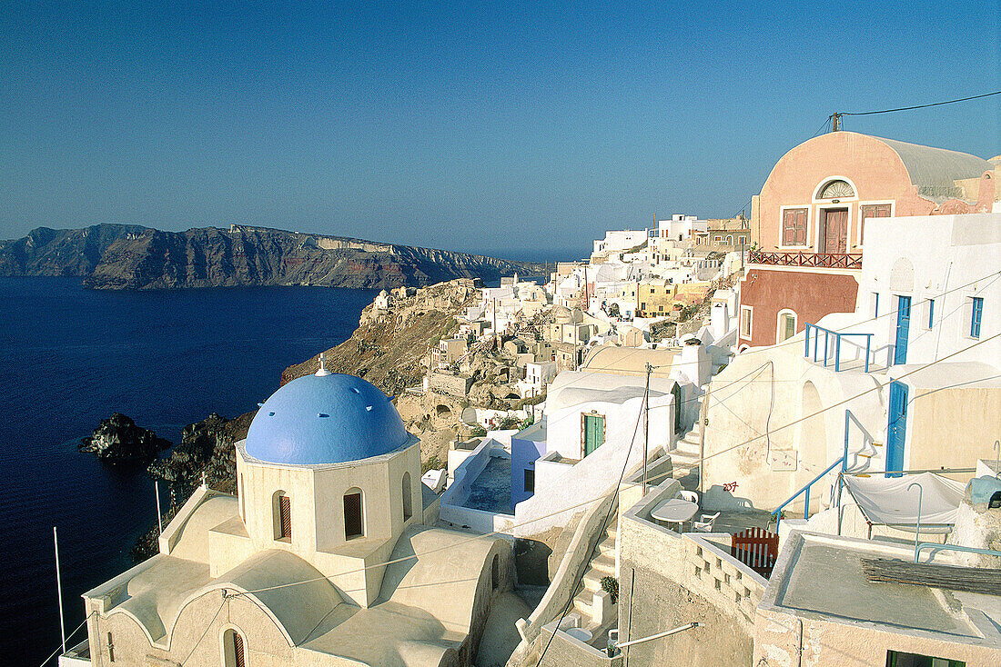 Ia village. Churches Domes and belfries painted in blue. Santorini. Greece