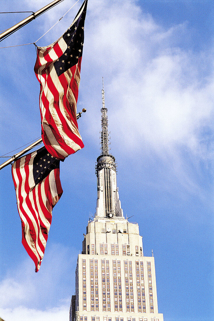 American flags and Empire State building, New York City. USA