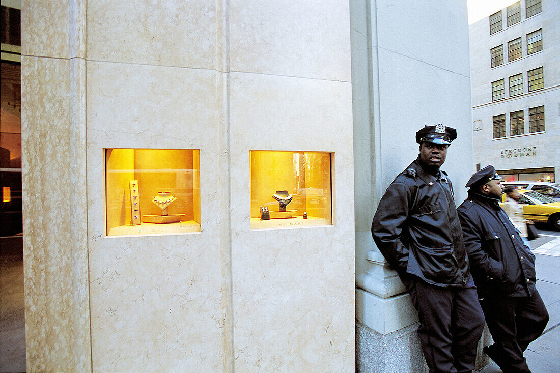 Vigils dressed as policemen by Bulgari jewelry shop windows in 5th Avenue, Manhattan. New York City, USA