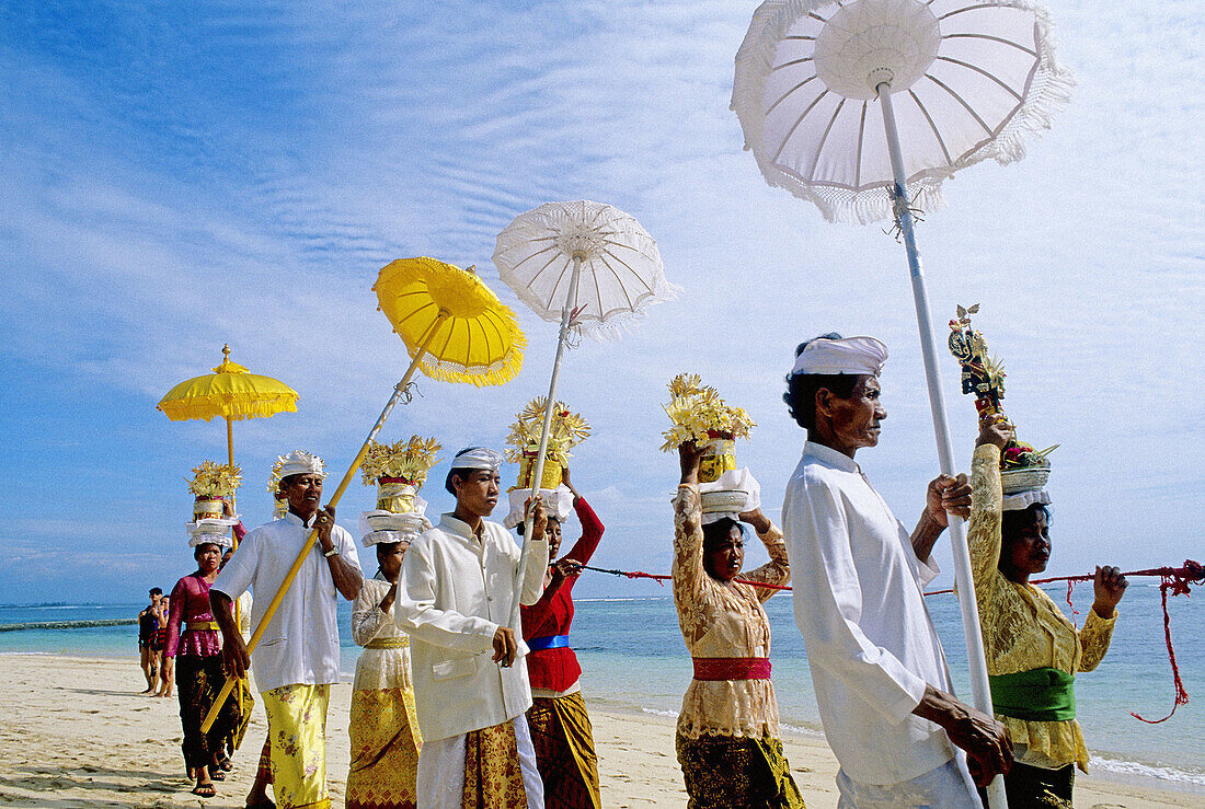Purification ceremony hold on a Nusa Dua beach nearby touristic hotels. Bali island. Indonesia