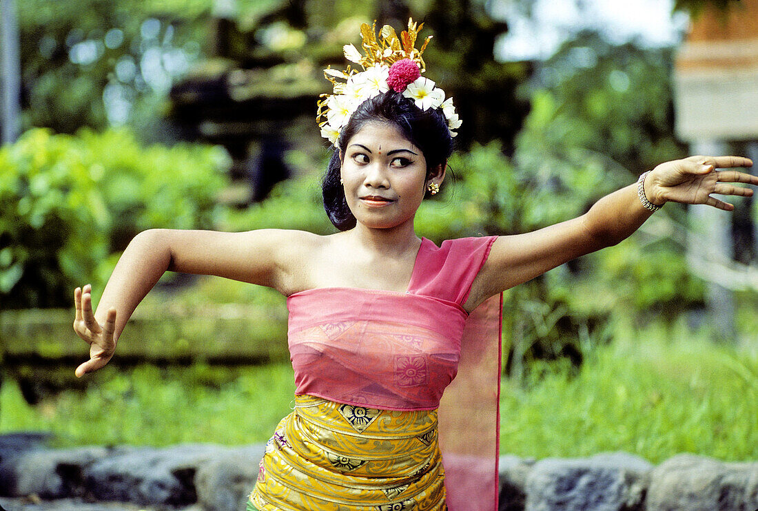 Young lady performing Pendet traditional dance. Bali island. Indonesia (model released)
