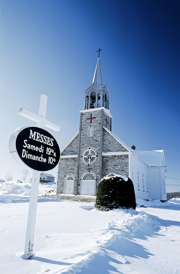 Church and Christ statue. City of Quebec in winter. Quebec. Canada