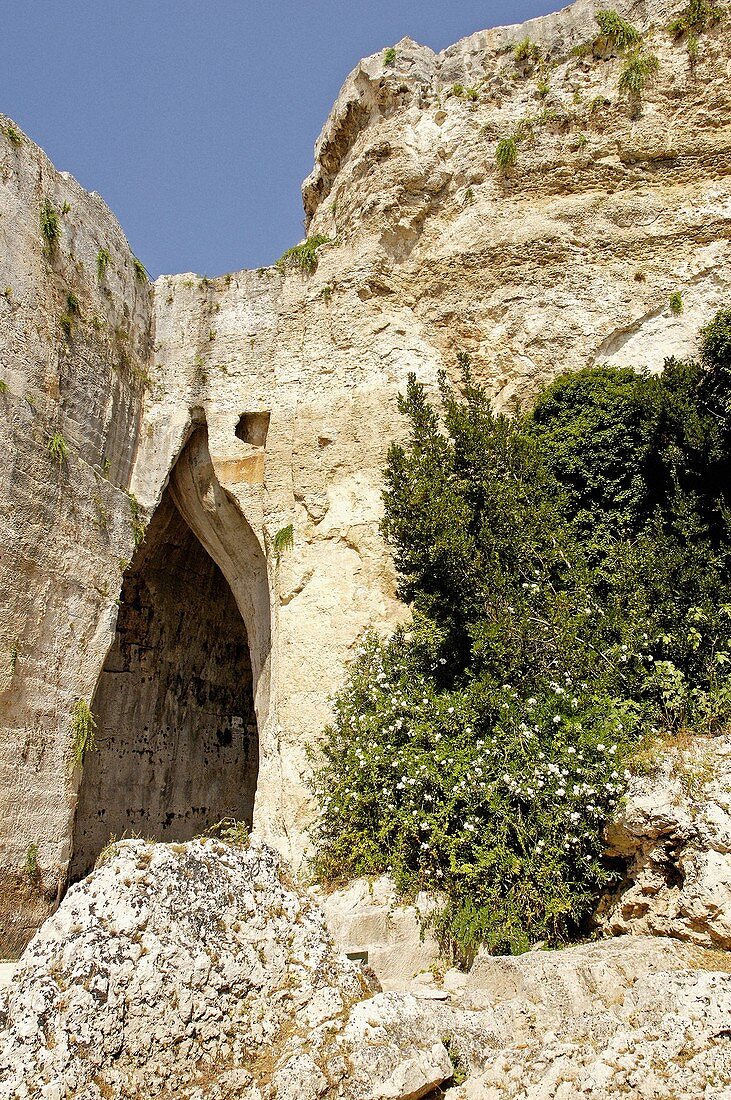 The tyran Denys s ear (window in the rock) Latomia del Paradiso in the large stone quarry near the Greek and Roman theater. Syracusa. Sicily. Italy.