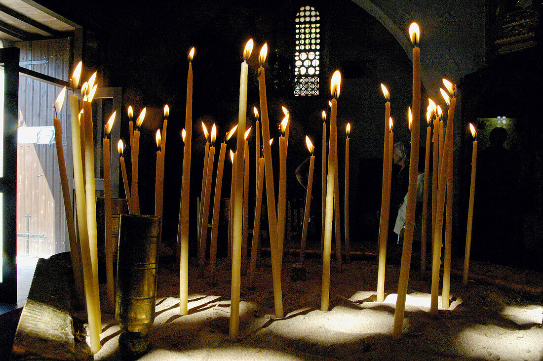 Burning candles in the Saint Neophytos monastery church. Cyprus