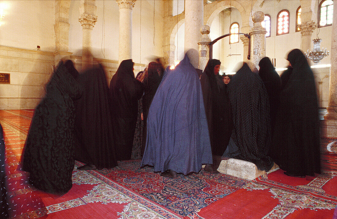 Iranian women on pilgrimage praying at St John baptist tomb. Great Omeyade Mosque. Damascus. Syria