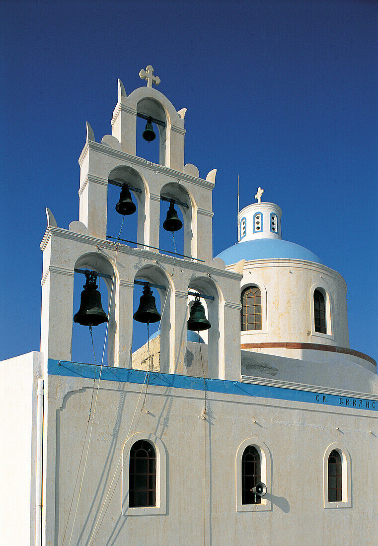 Colored Belfry & church dome. Santorini island. Cyclades. Greece