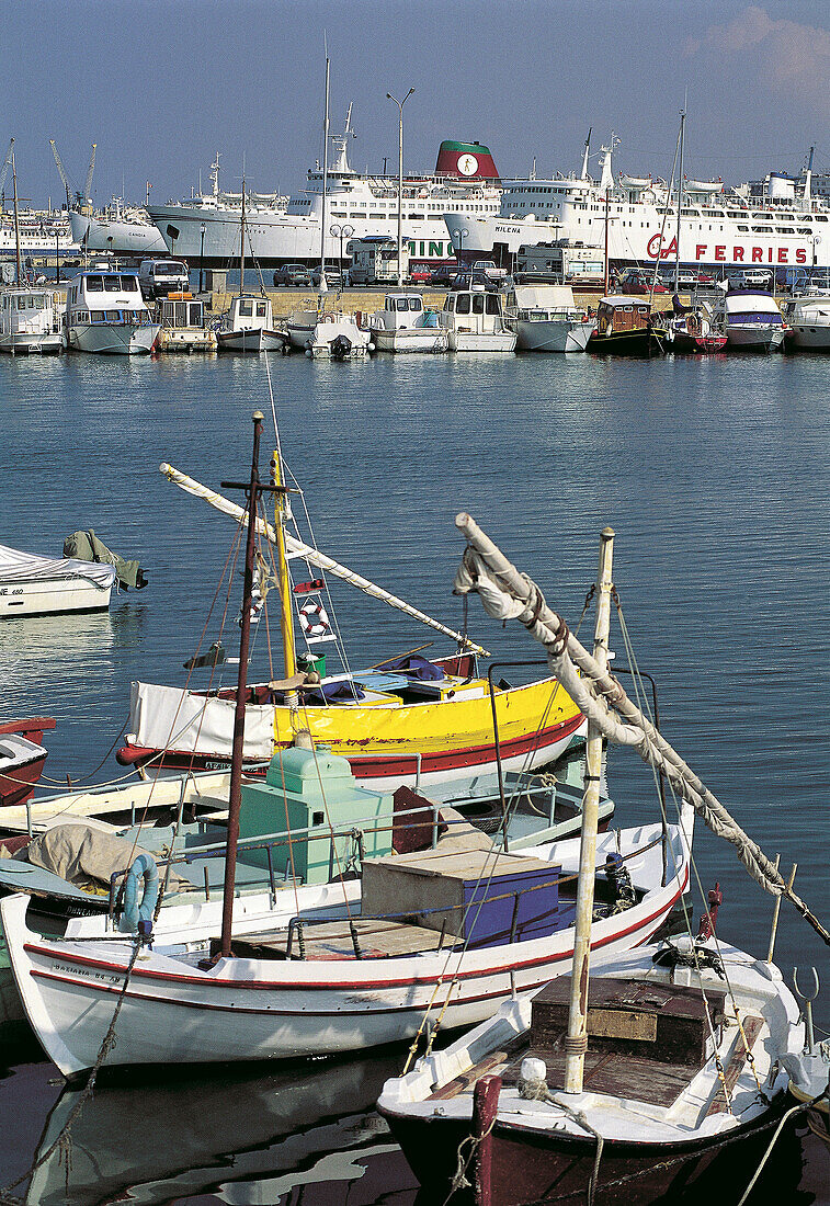 Harbour , fishing boats at quay on foreground. Heraklion. Crete