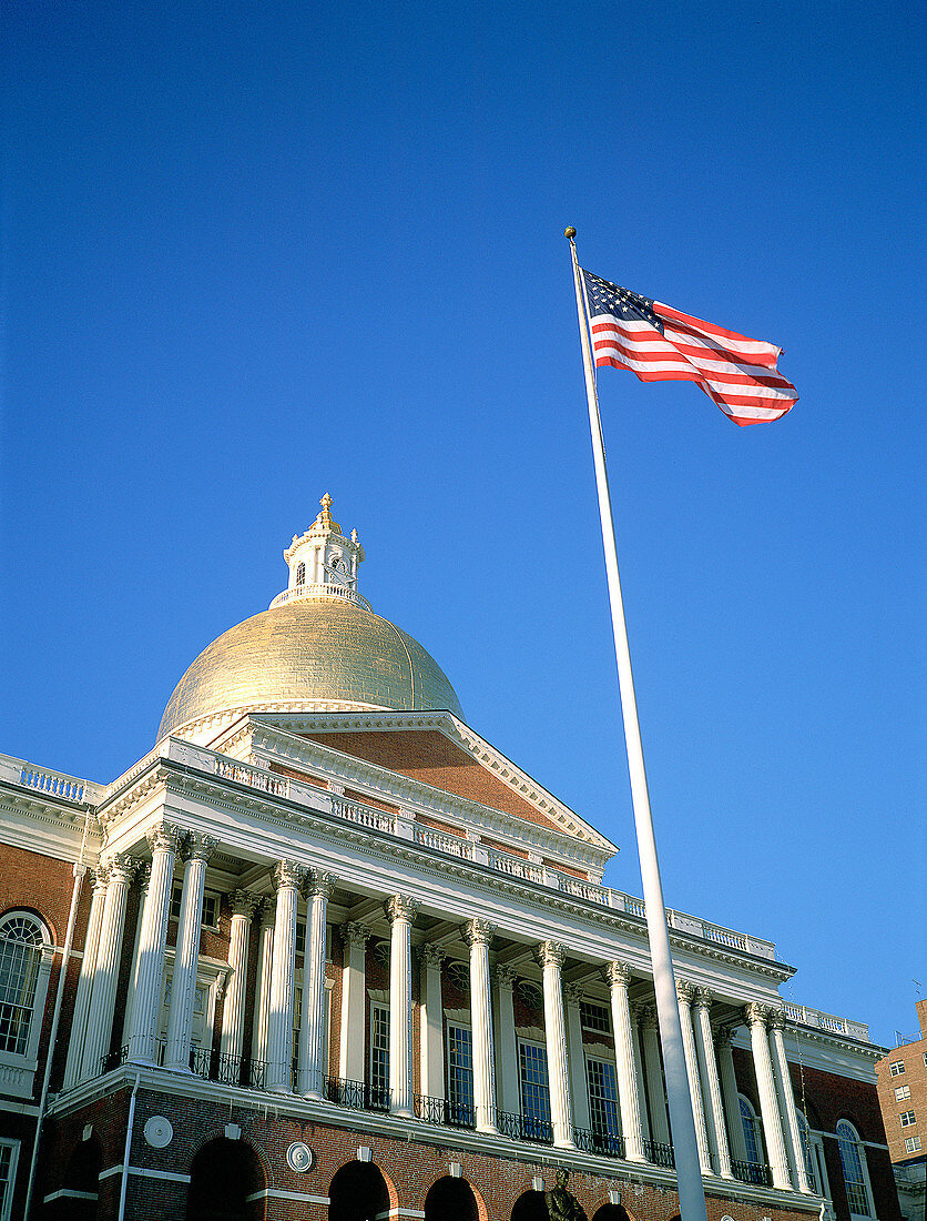 State Capitol and U.S. Flag. Boston. MA. USA