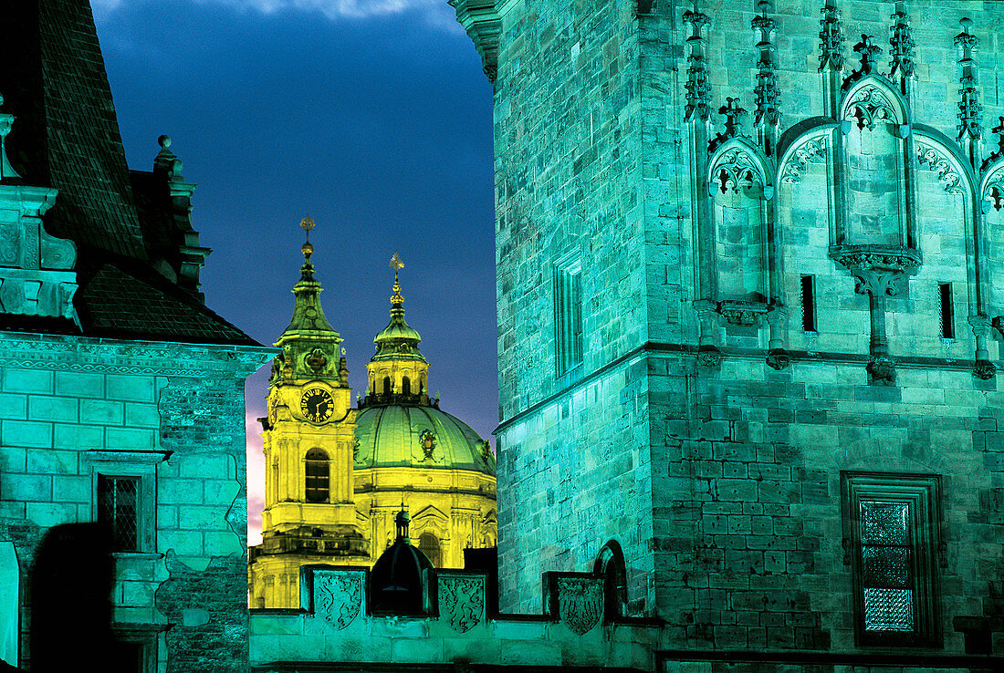 Tower of Mala Strana bridge and domes of St. Nichola s church. Prague. Czech Republic