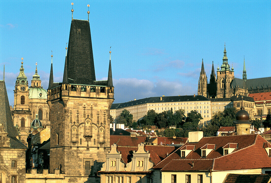 Hradcany hill and city roofs, Charles Bridge tower in foreground. Prague. Czech Republic