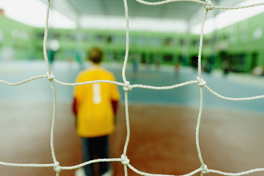  Back view, Boy, Boys, Color, Colour, Compete, Competing, Competition, Competitions, Contemporary, Costume, Costumes, Five-a-side football, Goal, Goalie, Goalies, Goalkeeper, Goalkeepers, Goals, Human, Indoor, Indoors, Inside, Interior, Male, Match, Match