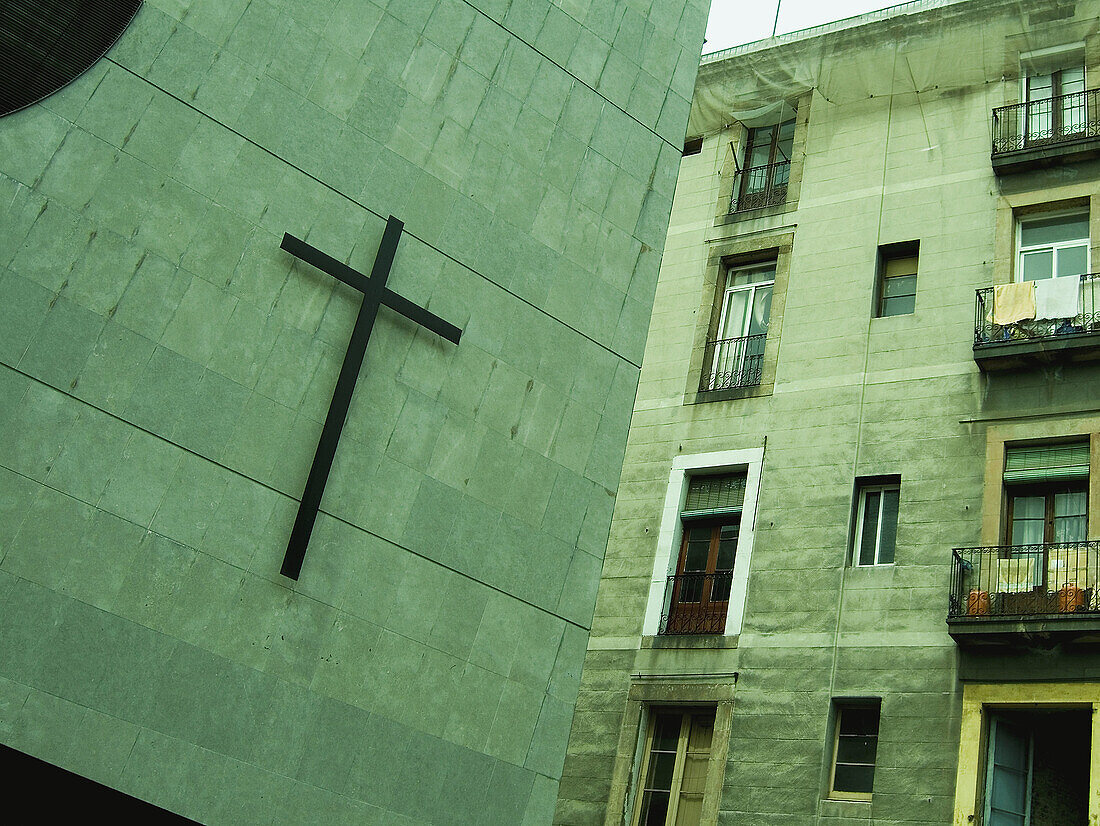 Cross in a church wall, Barcelona, Spain.