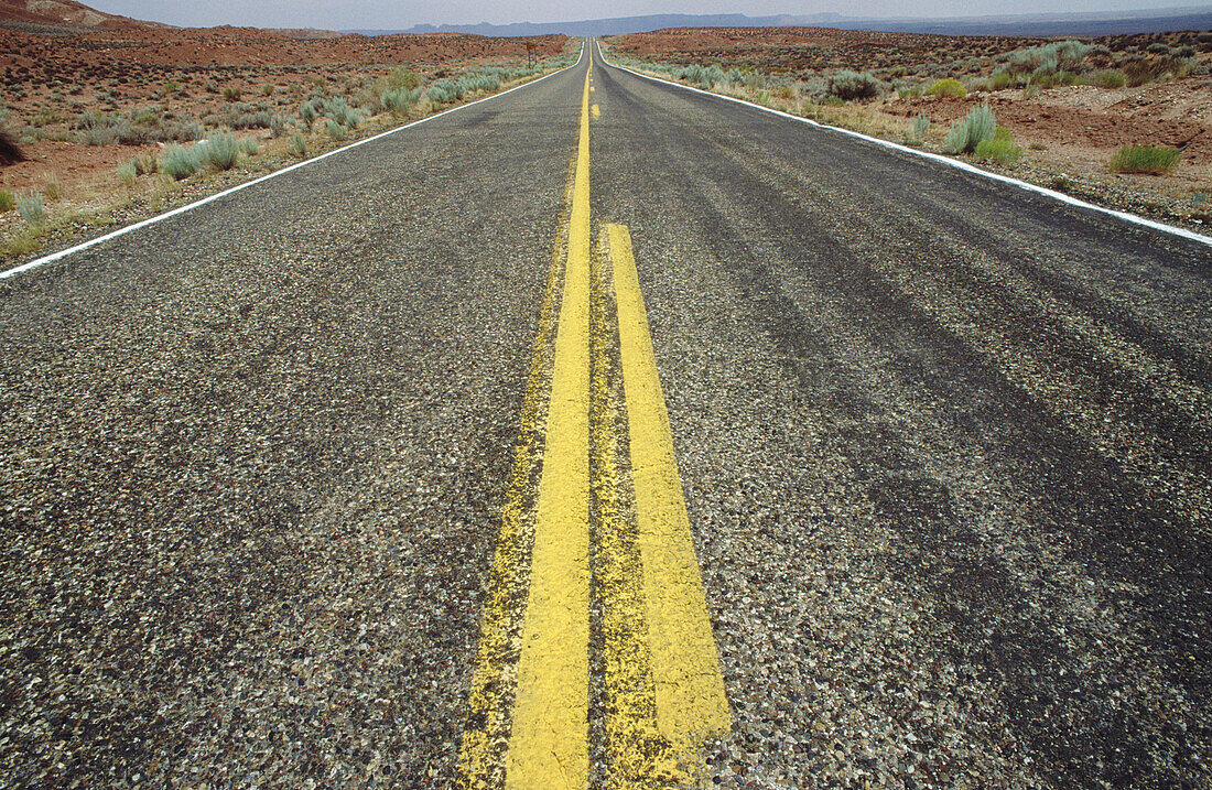 USA, Arizona, Jacob Lake. Roughly painted yellow line in middle of highway 89A.