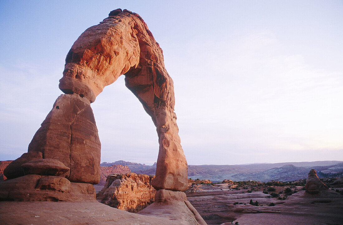 USA, Utah, Moab. The Delicate Arch at sunset, most famous of the Arches National Park features.