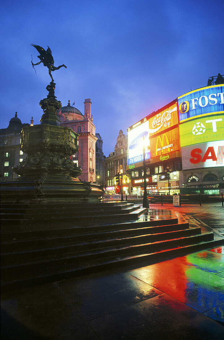 Commercial signs and statue of Eros in Piccadilly Circus. London, England