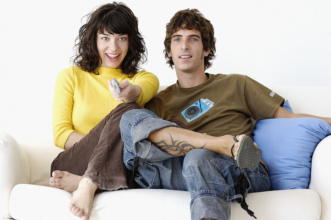 Couple sitting on the sofa at home