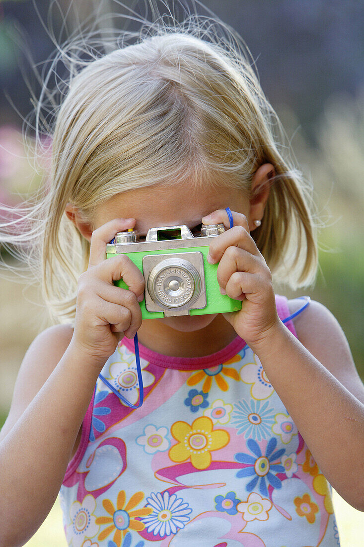 Children, Color, Colour, Contemporary, Daytime, Exterior, Facing camera, Fair-haired, Female, Girl, Girls, Hobbies, Hobby, Human, Imagination, Infantile, Kid, Kids, Leisure, Looking at camera, One, O