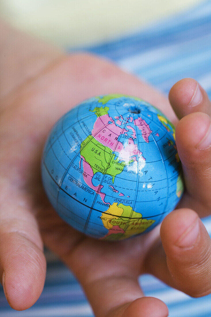  Child, Children, Close up, Close-up, Closeup, Color, Colour, Concept, Concepts, Contemporary, Earth, Geography, Globe, Globes, Hand, Hands, Hold, Holding, Human, Idea, Ideas, Indoor, Indoors, Interior, Kid, Kids, Little, North America, Object, Objects, O