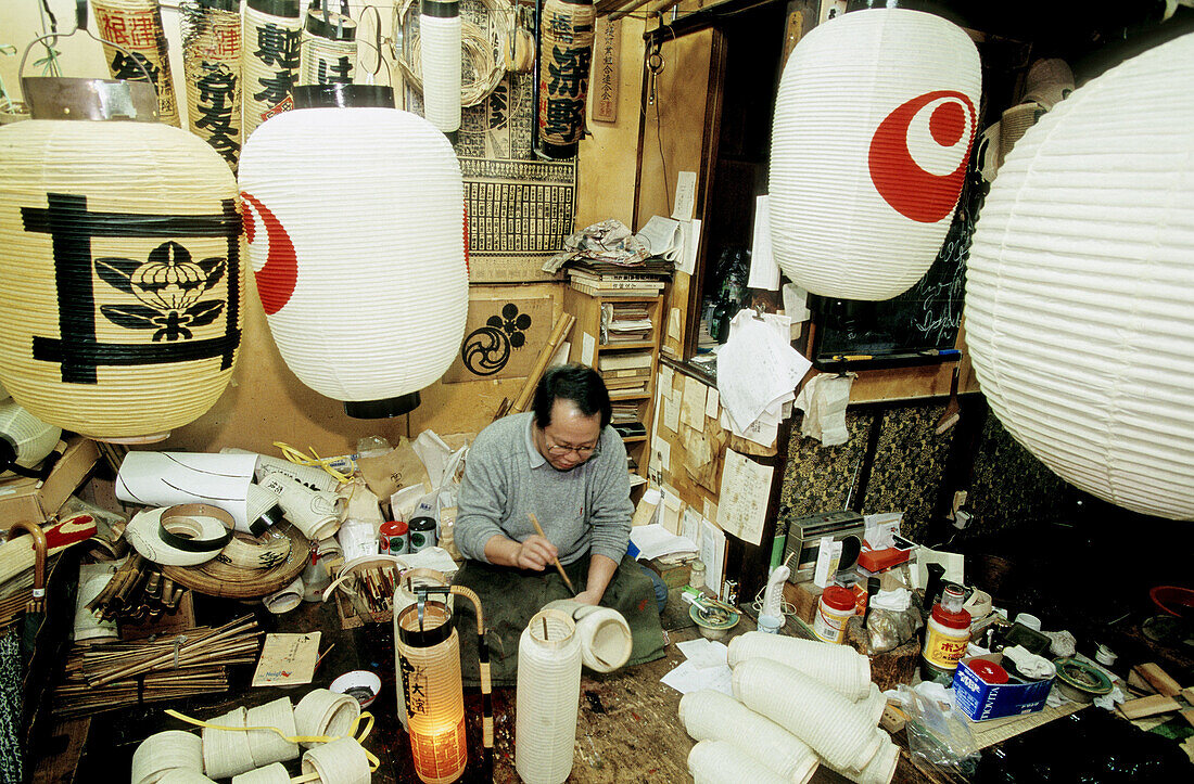 Craftsman making traditional lanterns. Tokyo, Japan