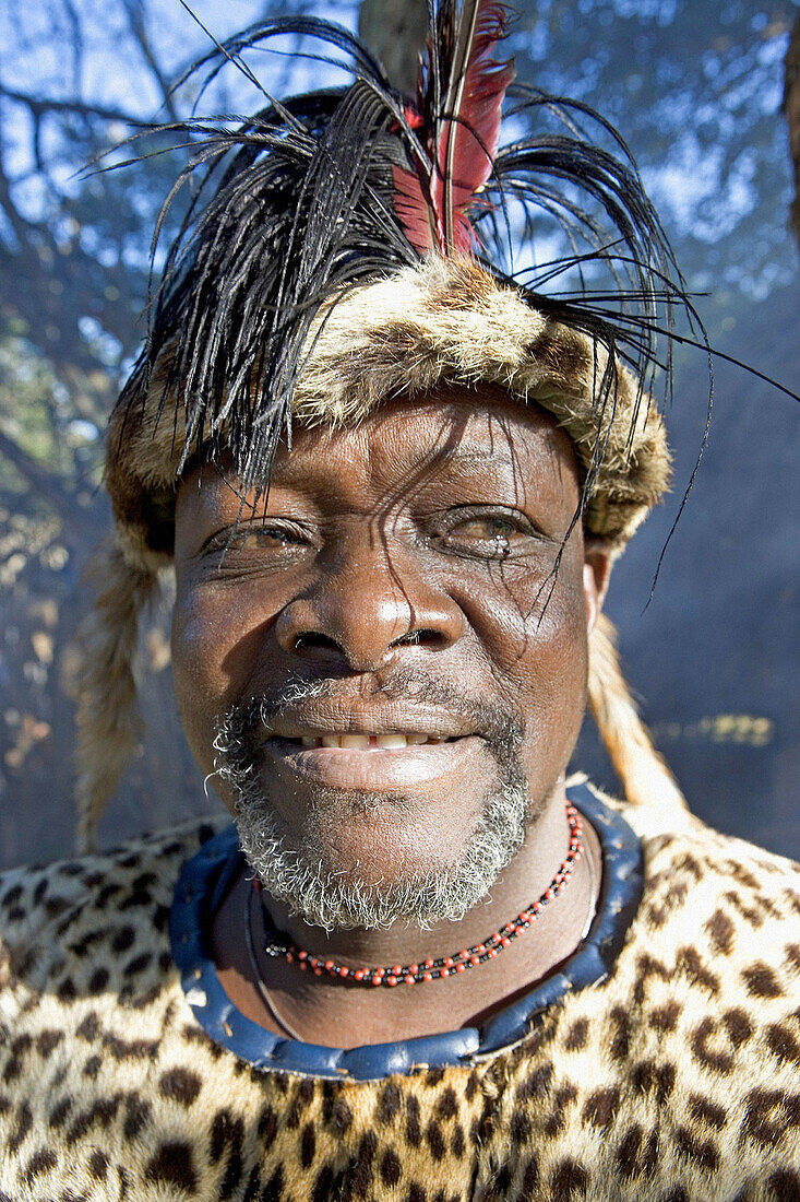 The Chief Biyela dressed with his ceremonial leopard skin . Simunye zulu village where visitors can be accomodated in zulu style. Kwazulu-Natal province. South Africa