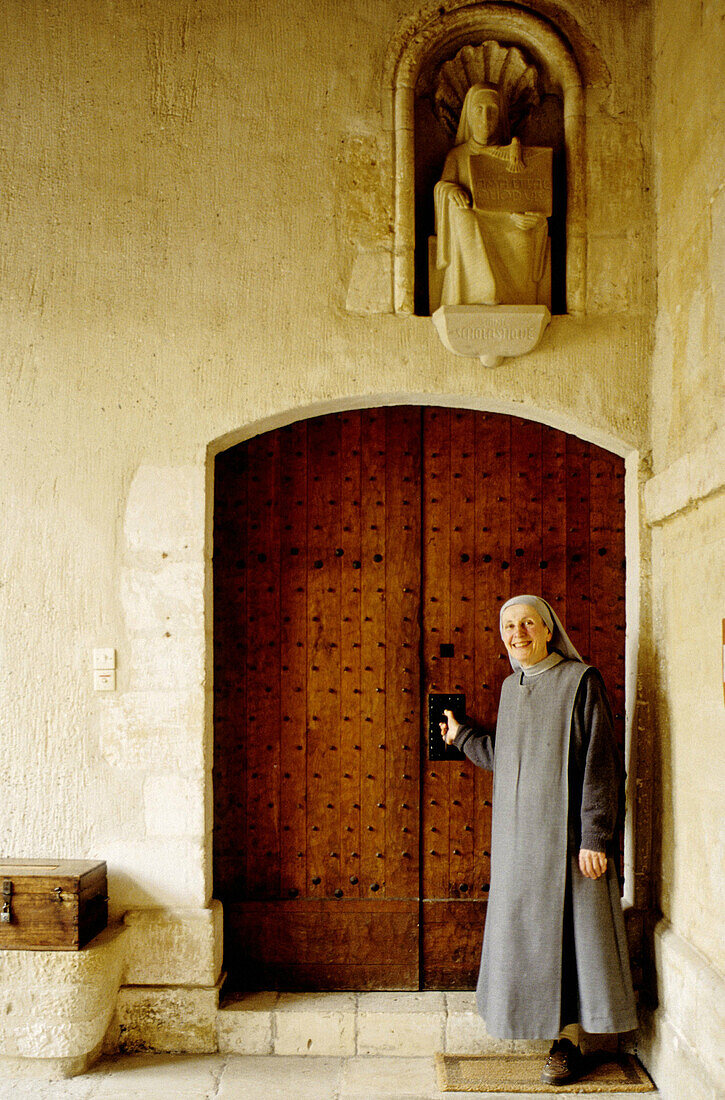 Nun entering abbey. Manche, Normandy, France