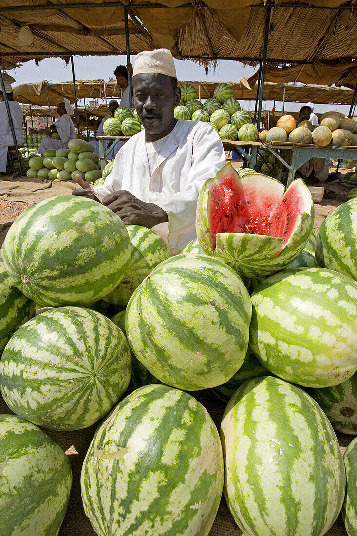 Watermelon seller at market, Atbarah. Upper Nubia, Blue Nile state, Sudan