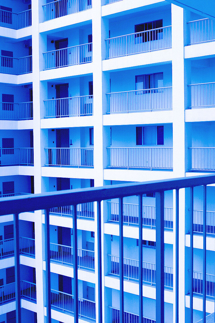 Cool toned interior courtyard of luxury high-rise apartment building