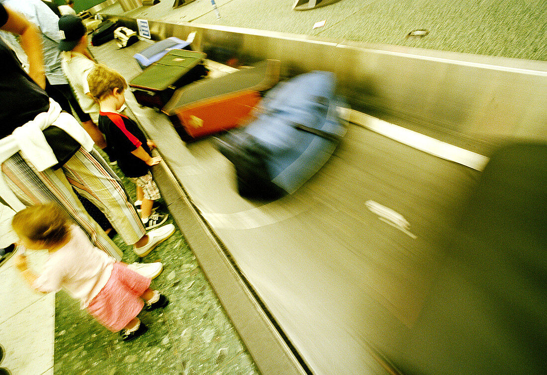  Adult, Adults, Airport, Airports, Baggage, Baggage claim, Blurred, Child, Children, Color, Colour, Contemporary, Families, Family, Horizontal, Human, Indoor, Indoors, Infant, Infants, Inside, Interior, Kid, Kids, Luggage, Motion, Movement, Moving, People