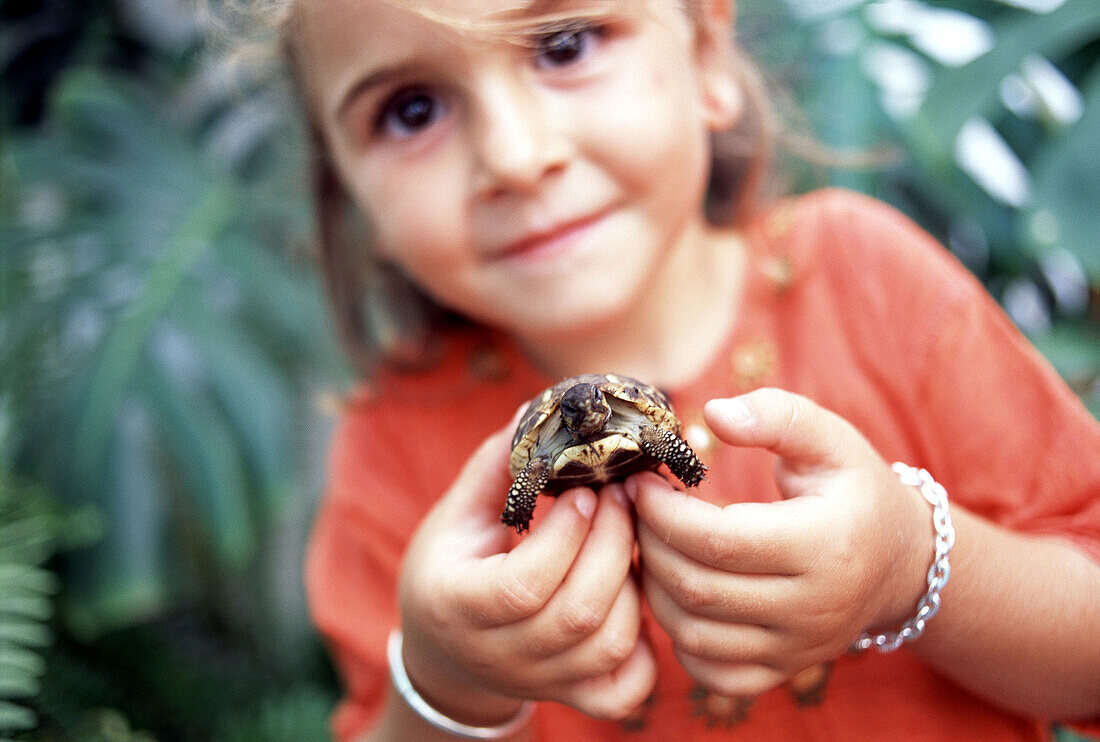Little girl with turtle