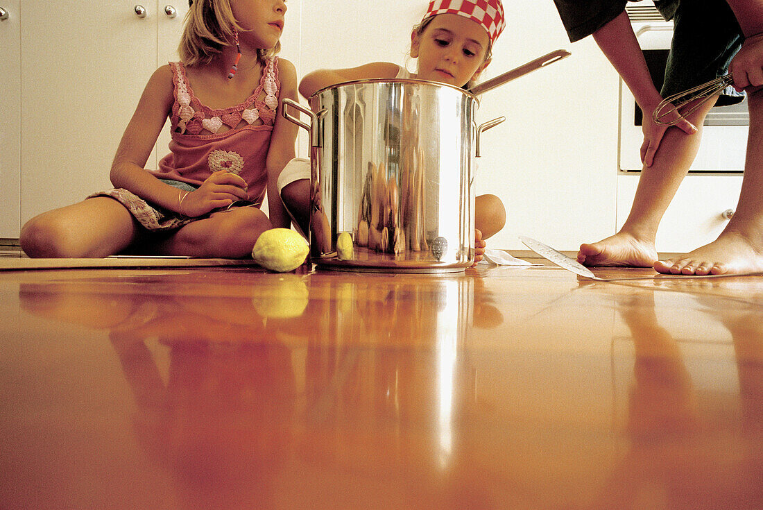 Children playing in the kitchen