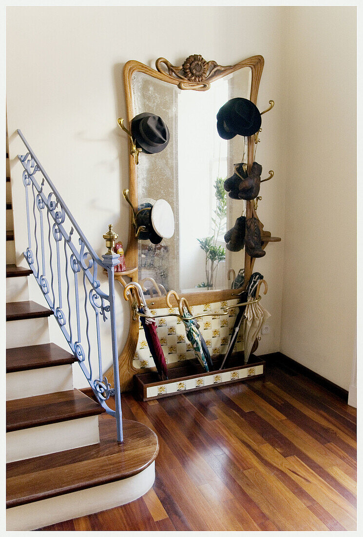  At home, Banister, Banisters, Bowler hat, Bowler hats, Boxing glove, Boxing gloves, Color, Colour, Contemporary, Daytime, Decoration, Furniture, Hall, Halls, Handrail, Handrails, Hang, Hanging, Home, Indoor, Indoors, Interior, Mirror, Mirrors, Nobody, Ol