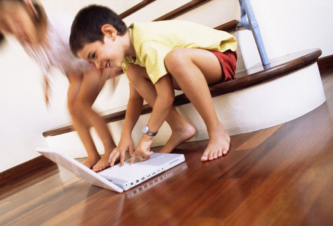ldhood, Children, Color, Colour, Computer, Computers, Contemporary, Families, Family, Female, Full-body, Full-length, Girl, Girls, Grin, Grinning, Home, Horizontal, Human, Indoor, Indoors, Infantile