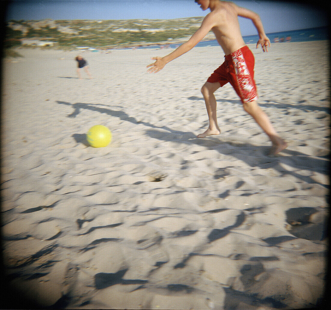  Amusement, Ball, Balls, Beach, Beaches, Color, Colour, Contemporary, Daytime, Exterior, Football, Fun, Holiday, Holidays, Horizontal, Human, Leisure, Outdoor, Outdoors, Outside, People, Person, Persons, Play, Playing, Recreation, Run, Running, Sand, Socc