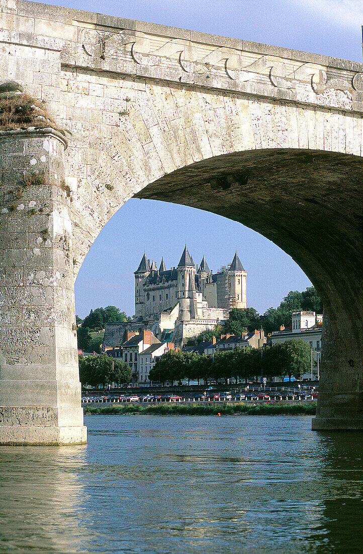 Arch of bridge over Loire River framing castle. Saumur. Val-de-Loire. France