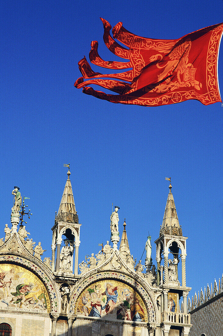 St. Mark s Basilica and Venetian flag. Venice. Italy