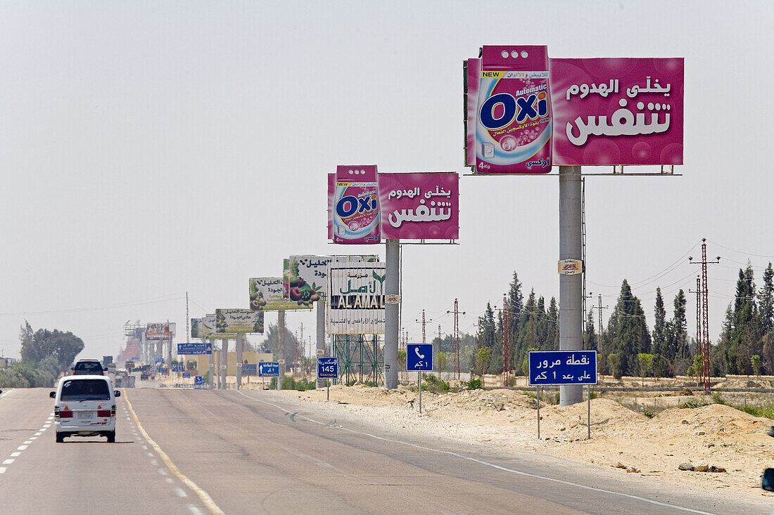 Ad billboards along the road from Cairo to Alexandria. Egypt