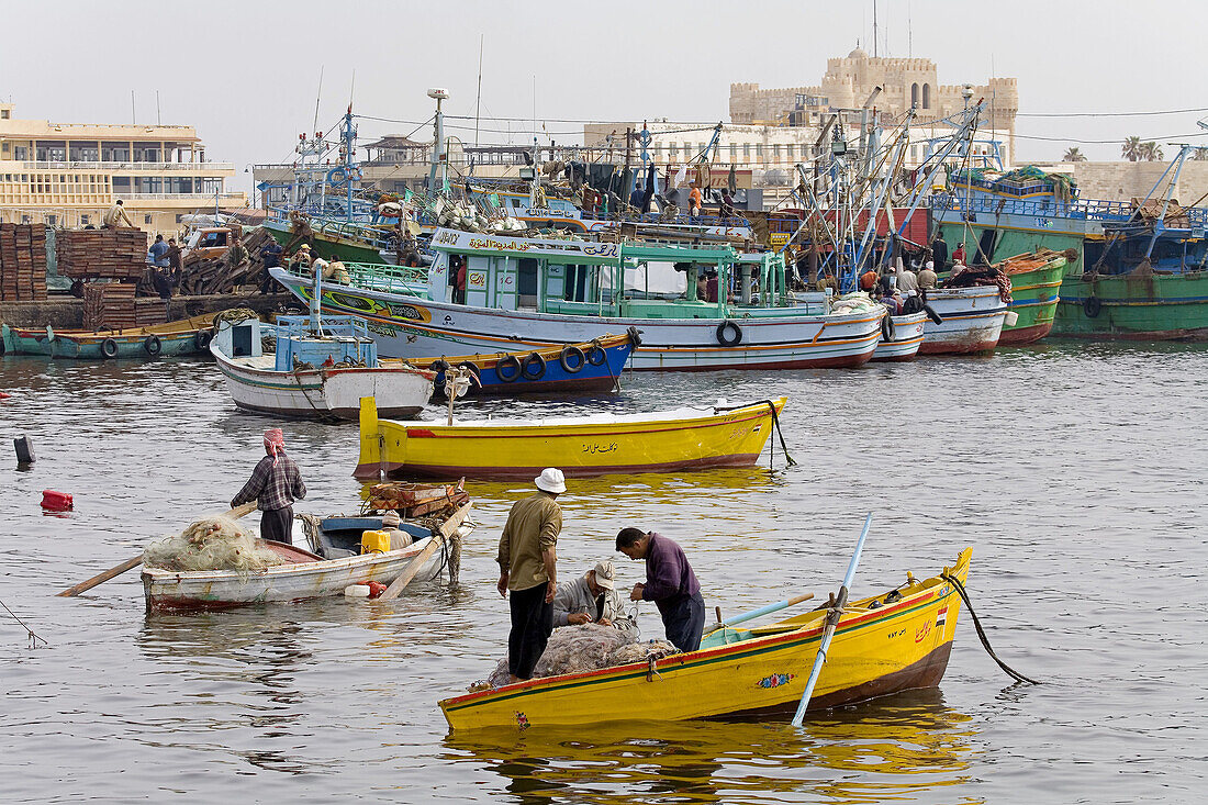 Fishermen boats along the sea side Corniche near the fishmarket. City of Alexandria. Egypt