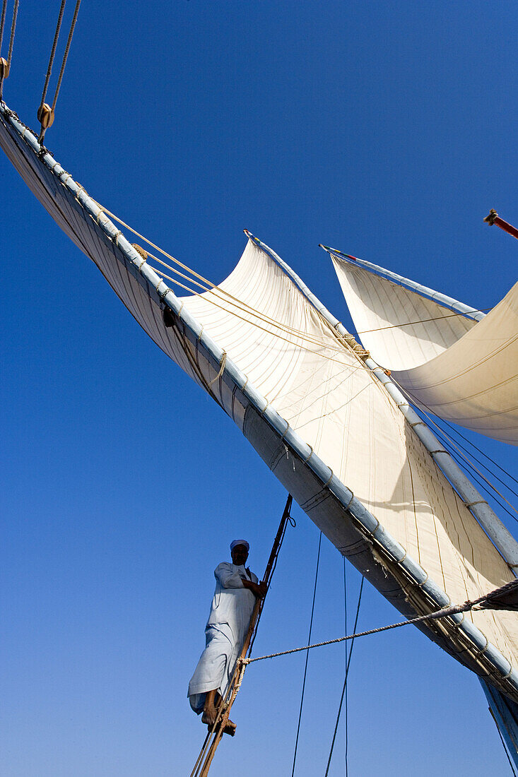 Twin masted large feluccas known as sandals . They were used formerly to carry stones and have been refurbished with a deck and cabins for sailing cruises on river Nile, south or north of Luxor. Upper. Egypt