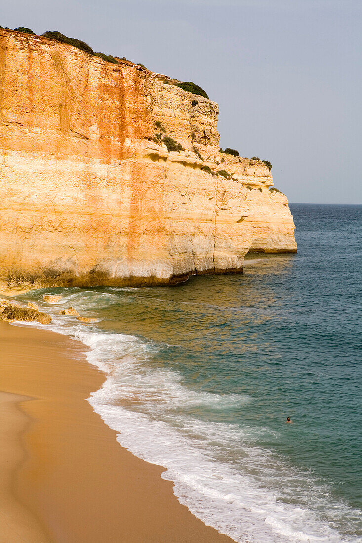Small beach and fishermen harbour on the coast near Albufeira. Algarve. Portugal