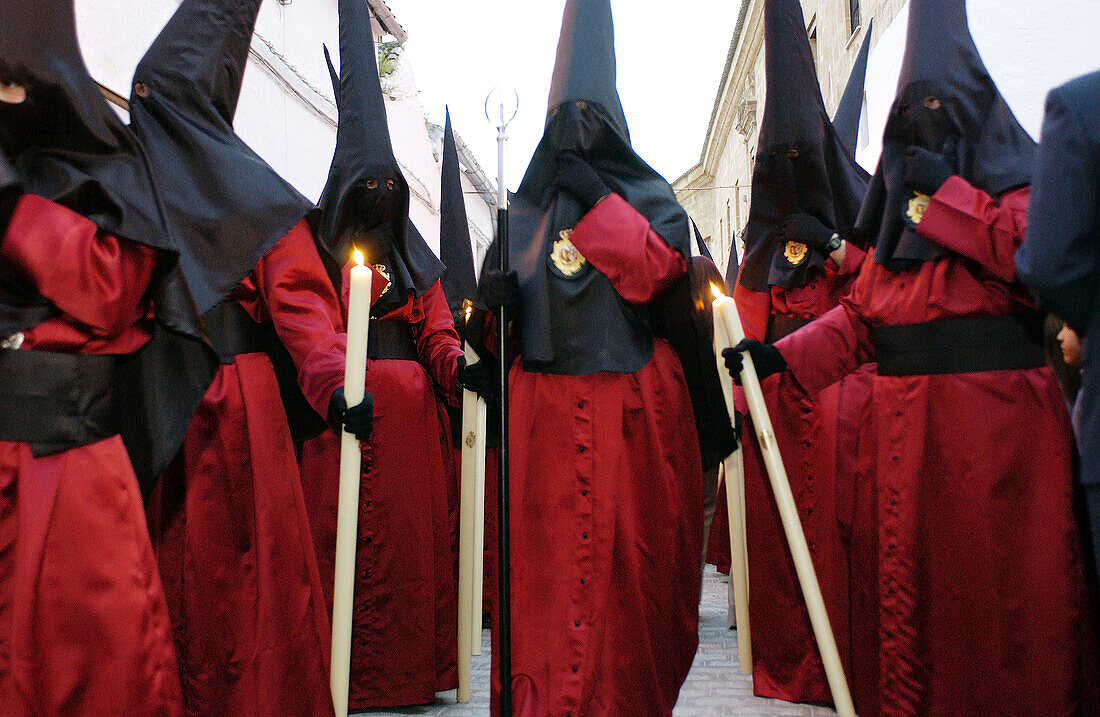 Penitents at procession during Holy Week. Osuna, Sevilla province. Spain