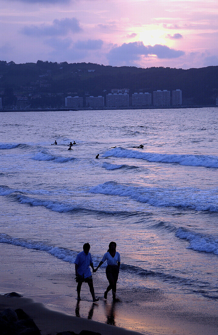 Couple at beach. Hendaye. Aquitaine. Atlantic Pyrenees. France