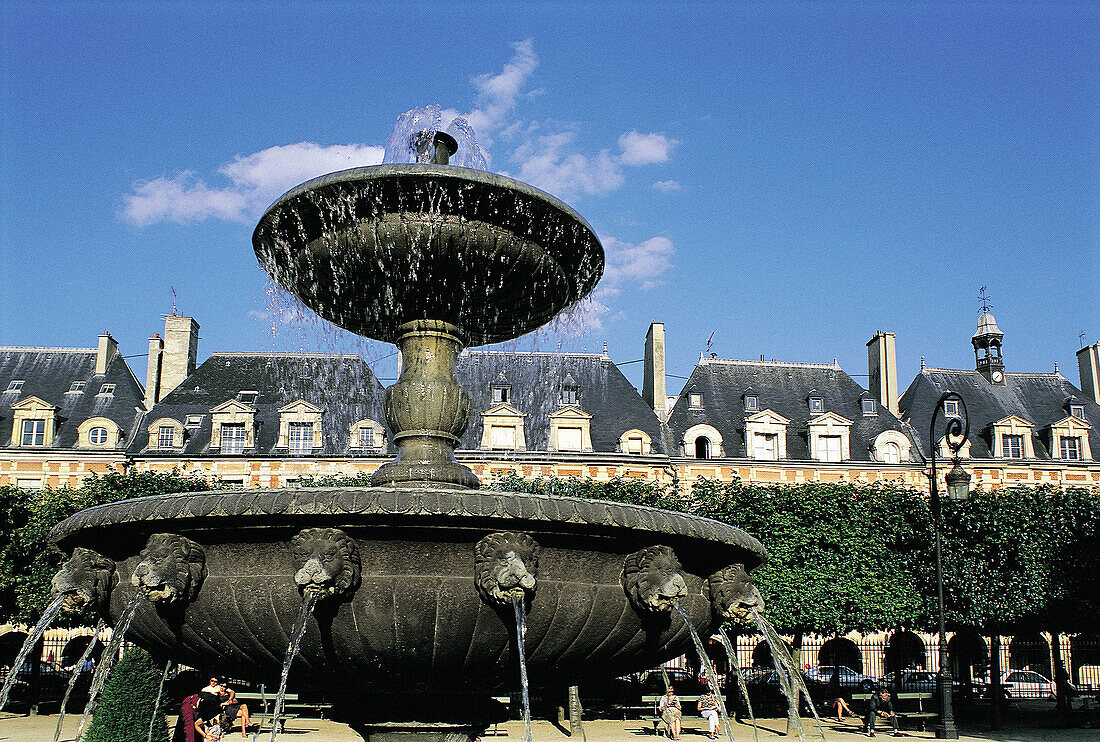 Fountain at Place des Vosges (formerly Place Royal, planned in 1603). Paris. France